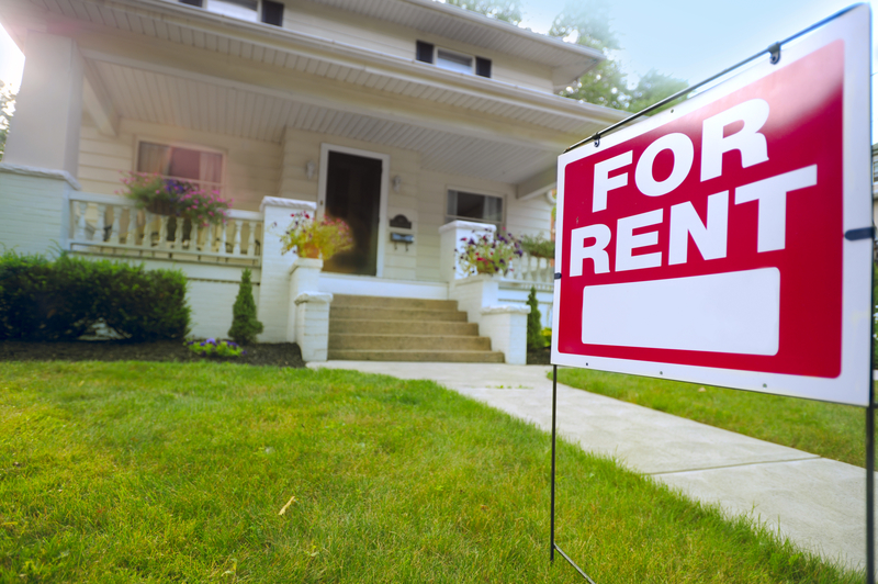 Image of house with for rent sign